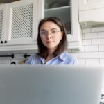 Distance work from home concept. Female freelancer working at home