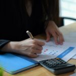 Female executives are finalizing a budget plan.